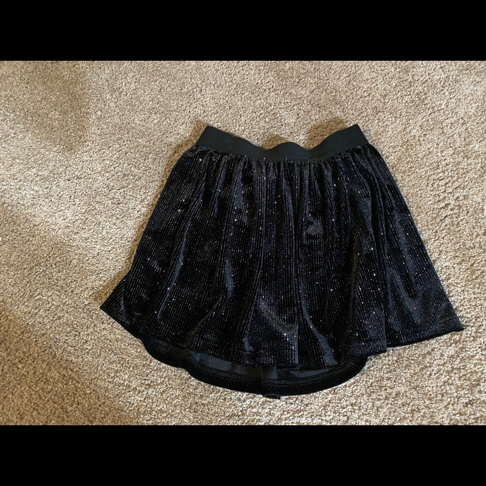 Black shimmer mini skirt. Justice size 8.